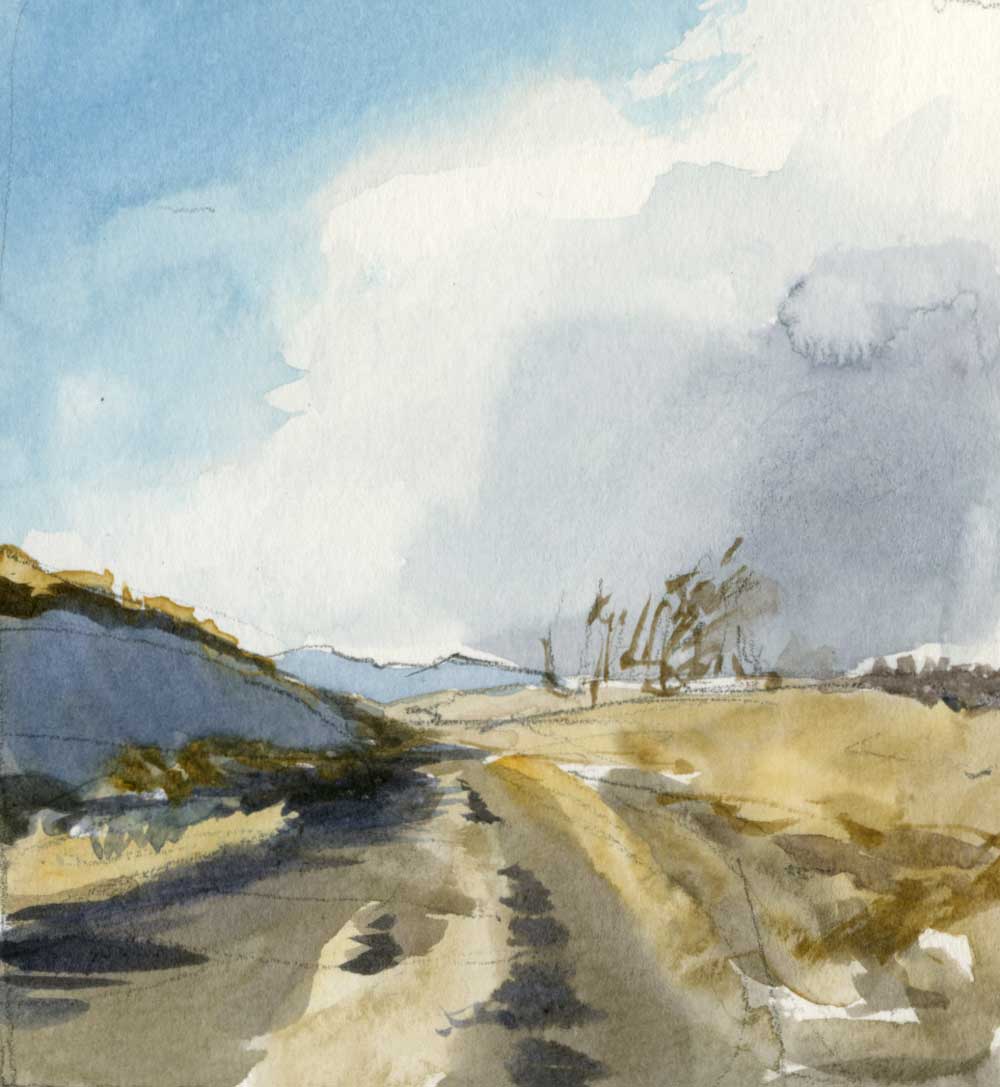 watercolor sketch of a dirt road leading up a slope between banks of snow and dry grass, with distant mountains and a partly cloudy sky in the distance.